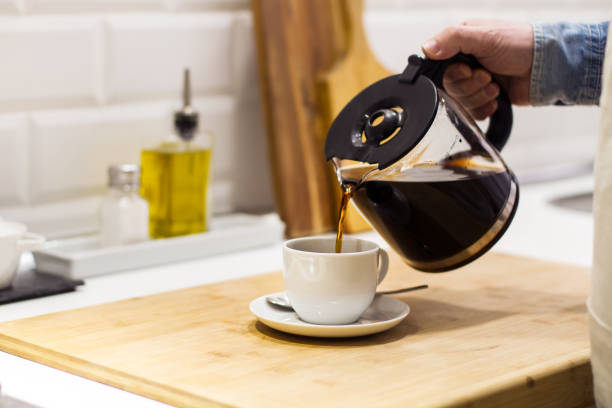 istock Man serving a filtered coffee in the kitchen 1139069613
