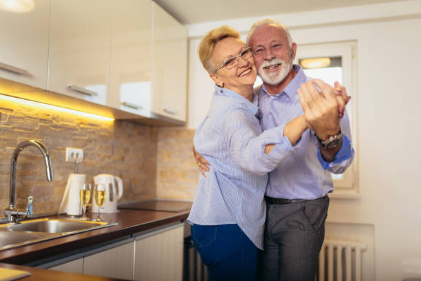 istock Senior couple dancing together in kitchen 1139070800