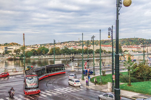 Prague, Czech Republic, October 14, 2014 - Modern tram of the manufacturer Skoda on the Vltava river in Prague.