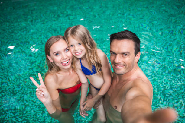 istock Cheerful family resting in water 1139076119