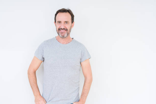 istock Handsome senior man over isolated background Relaxed with serious expression on face. Simple and natural looking at the camera. 1139078631