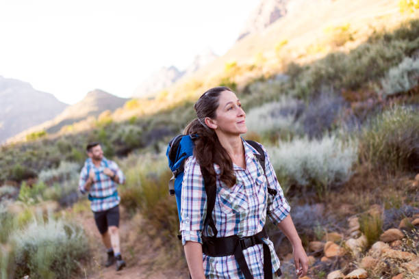 istock Young woman smiling looking at the path ahead 1139082247