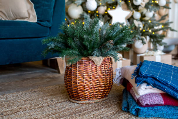 istock Branches of a Christmas tree in a wicker basket. 1139084416