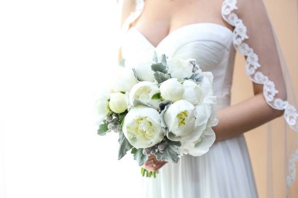 istock Joyful bride holding beautiful bridal bouquet 1139085197