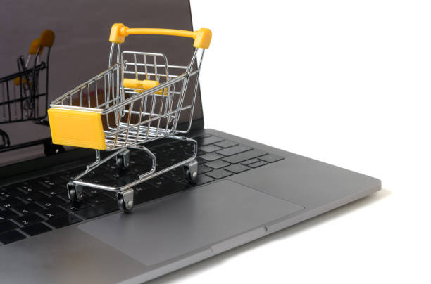istock Trolley on a laptop keyboard isolated on white 1139086893