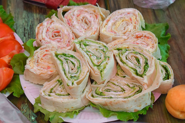 Rolls stuffed with herbs and sauce on the table for a holiday tasty