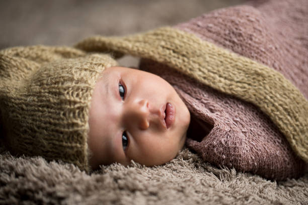 istock Newborn baby wrapped in fur blanket 1139091461