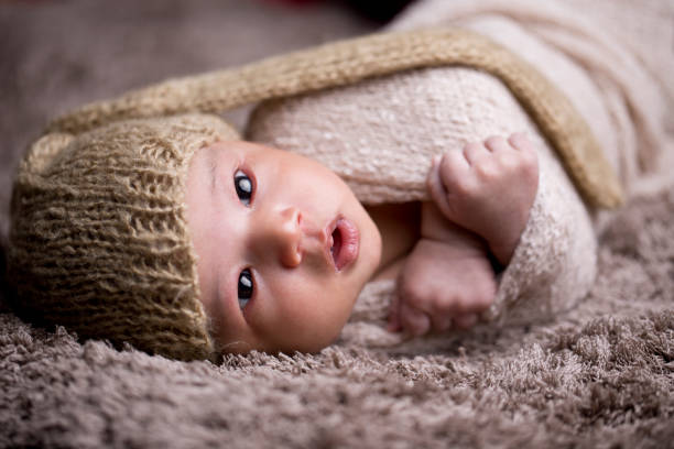 istock Newborn baby wrapped in fur blanket 1139091535