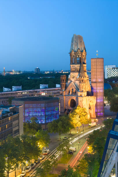 Kaiser Wilhelm Memorial Church and Berlin Skyline at dusk Elevated view of Kaiser Wilhelm Memorial Church at dusk berlin germany kaiser wilhelm memorial church stock pictures, royalty-free photos & images