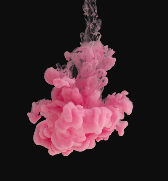 istock Pink ink cloud in water isolated on black 1139092383