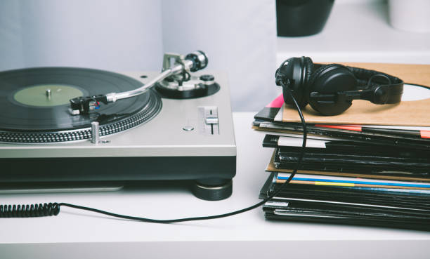 istock Turntable, headphones and stack of records on the white table. 1139093417