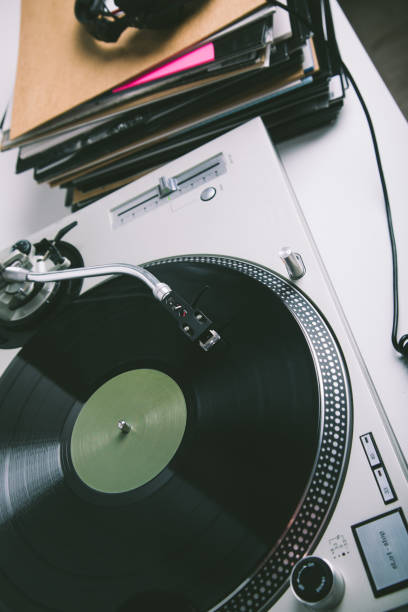 istock Turntable, headphones and stack of records on the white table. 1139093421