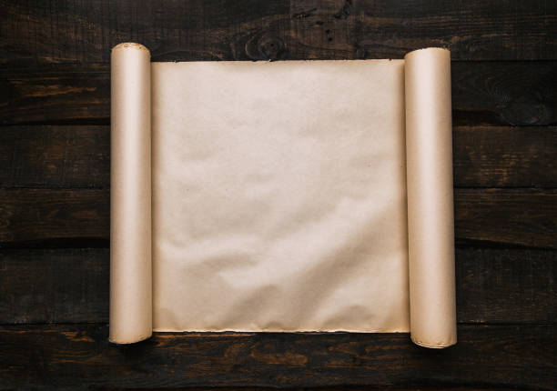 istock old paper on dark barn wood planks 1139094181