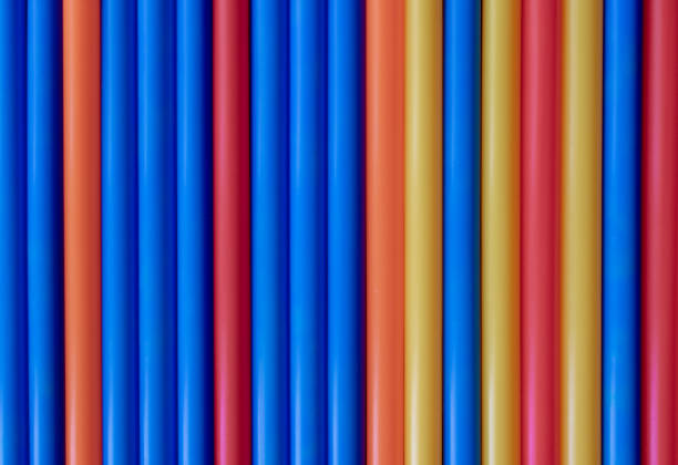 istock Colorful pastel plastic tubes straws background 1139095171