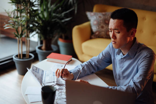istock Man calculating his financial bills 1139096245