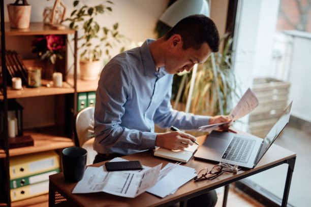 istock Man calculating his financial bills 1139096704