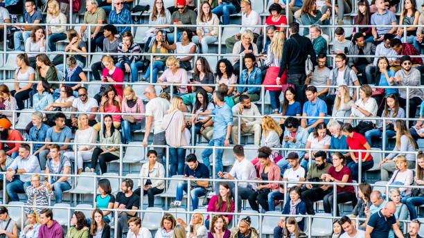 istock People walking to their seats on stadium bleachers 1139097997