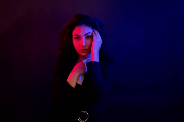 istock Attractive female in blue and red light 1139098210