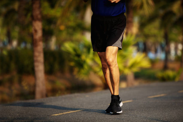 istock old man runner feet running on asphalt road closeup 1139098212