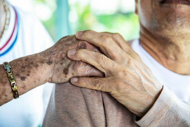 istock Senior couple holding hands close up 1139098249