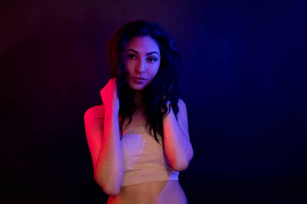 istock Attractive female in blue and red light 1139098302