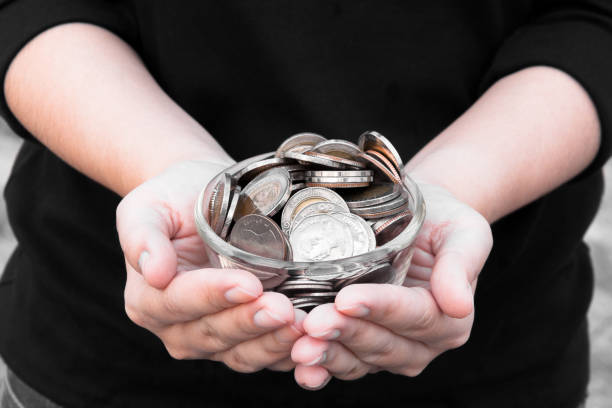 Coins in hands saving,Donation Investment Fund Financial Support Charity  Dividend Market  House Stock Trust Wealthy Giving Planned Accounting Collection Debt Banking Coins in hands saving,Donation Investment Fund Financial Support Charity  Dividend Market  House Stock Trust Wealthy Giving Planned Accounting Collection Debt Banking ROI a penny saved stock pictures, royalty-free photos & images