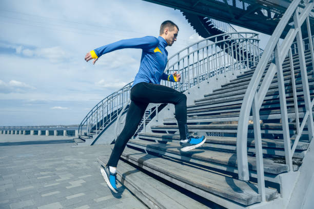 istock Man running on city background at morning. 1139099821