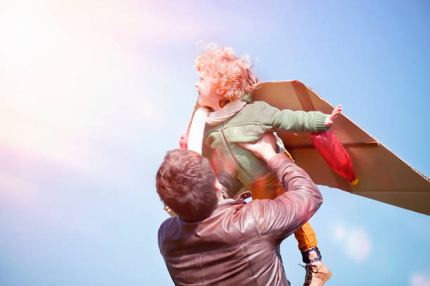 istock Child Flying in a Cardboard Plane 1139101195