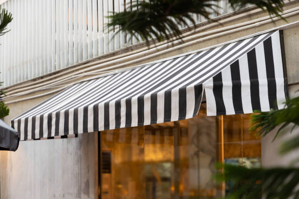 istock black and white awning over shop window. 1139101643