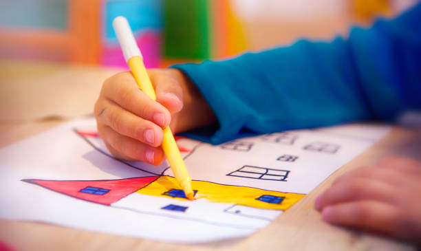 istock Child Painting using Colorful Markers 1139101895