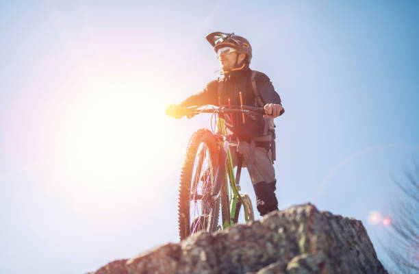 istock Mountain biker standing on the rocky terrain and looking away. 1139103030