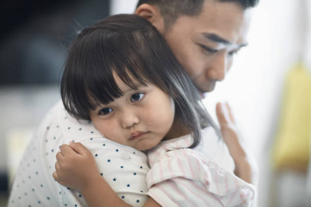 istock Father consoling cute sad daughter at home 1139103038