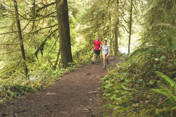 istock Couple running in the forest 1139104614