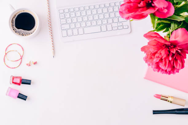 istock Flat lay blogger or freelancer workspace with a notebook, keyboard, red peonies on a white background 1139106250