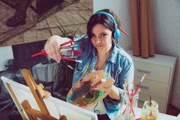 istock Female artist with paintbrush 1139106348
