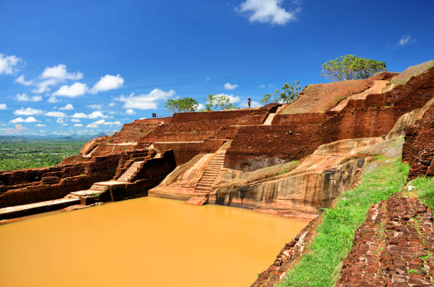 Rainy season in December brings rain clouds that cover the top of the great mountain fortress of Sigiriya,The Lion Rock,Palace of King Kashyapa,5th century CE,Central Provinces,Sri Lanka
