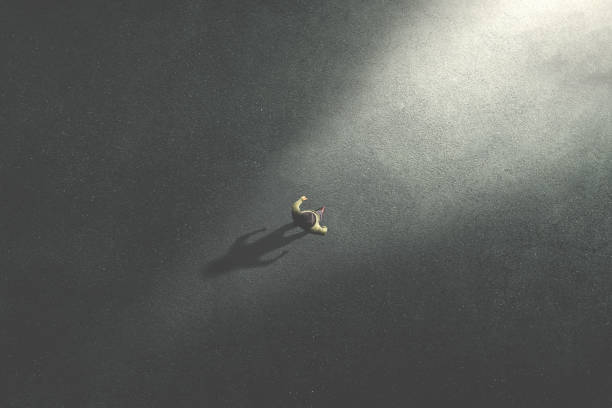 istock man walking in the night toward the light 1139107388