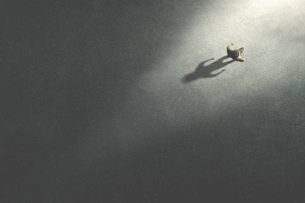 man walking in the night toward the light