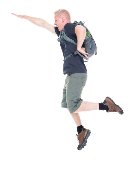 istock Attractive young male hiker jumping 1139109152