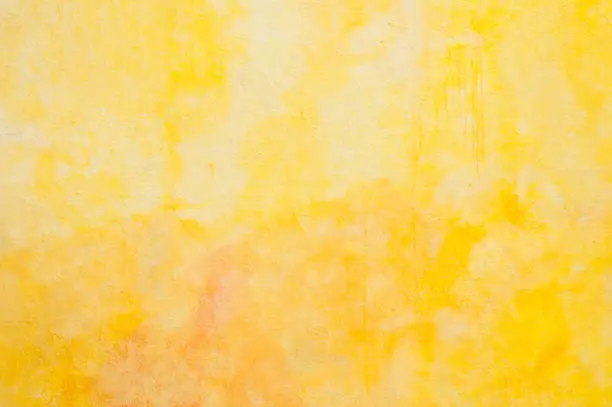 Photo of yellow painting on the wall texture