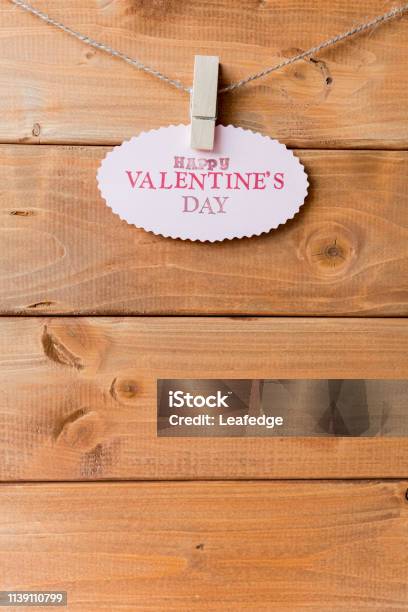 Valentines Day Message Card On The Planks Stock Photo - Download Image Now - Alphabet, Brown, Clamp