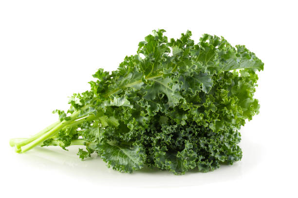 istock Fresh organic green kale leaves isolated over white background 1139114315