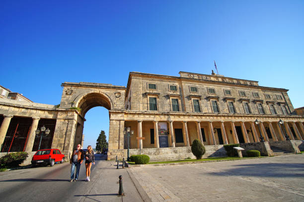 Corfu, Greece, October 18, 2018, The Palace of Saint Michel and Saint George in Piazza Spianada attracts many tourists Corfu, Greece, October 18, 2018, The Palace of Saint Michel and Saint George built by the English in Piazza Spianada attracts many tourists corfu holiday palace stock pictures, royalty-free photos & images