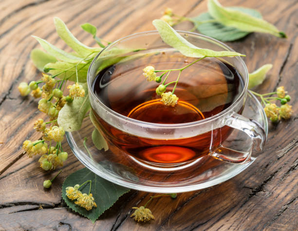 istock Cup of linden tea and lime flowers. 1139117601