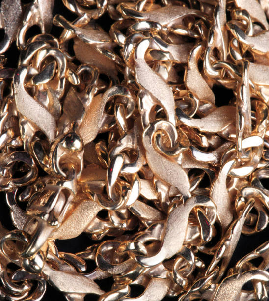 istock yellow Gold Chain on black fabric 1139122355