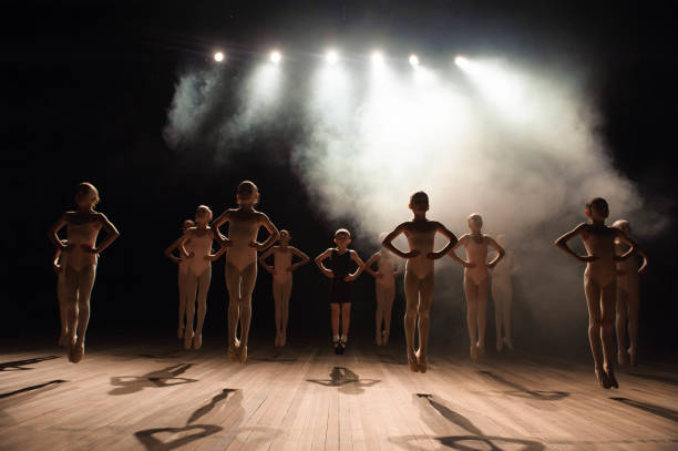 istock happy children doing ballet jump 1139125509