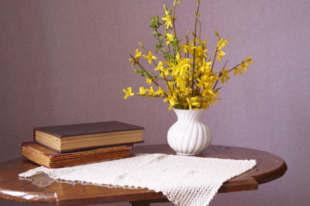 istock Vase with spring yellow flowers - Forsythia 1139125617