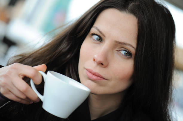istock Beautiful woman drinking a coffee 1139125694