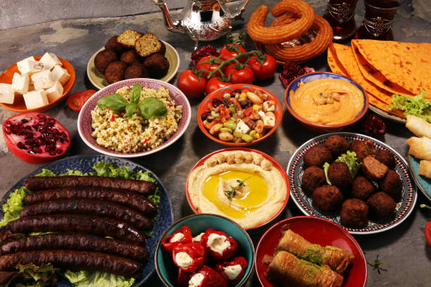 istock Middle eastern or arabic dishes and assorted meze, concrete rustic background. Falafel. Turkish Dessert Baklava with pistachio. Halal food. Lebanese cuisine 1139127063