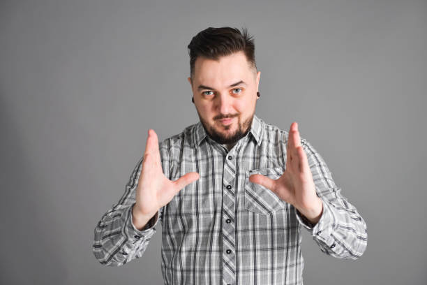 istock young bearded man bragging about big size of something 1139127216
